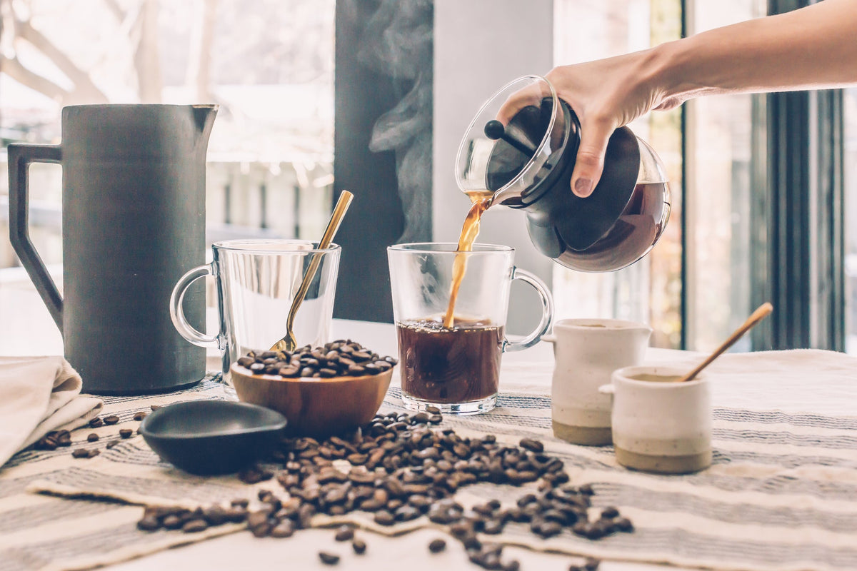 Pouring fresh coffee at the breakfast table